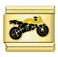 Gold charm with a black motorcycle design on a white background