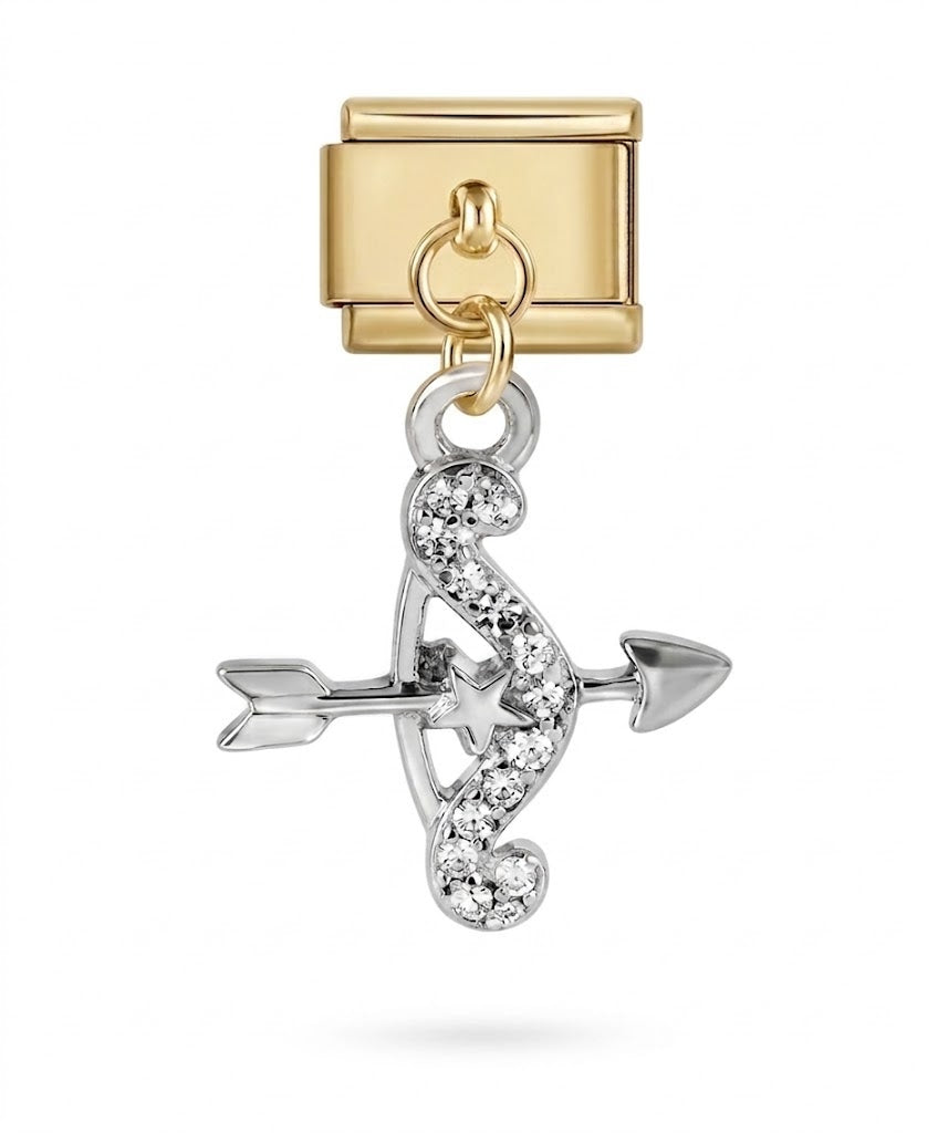 Gold charm with an arrow design on a white background