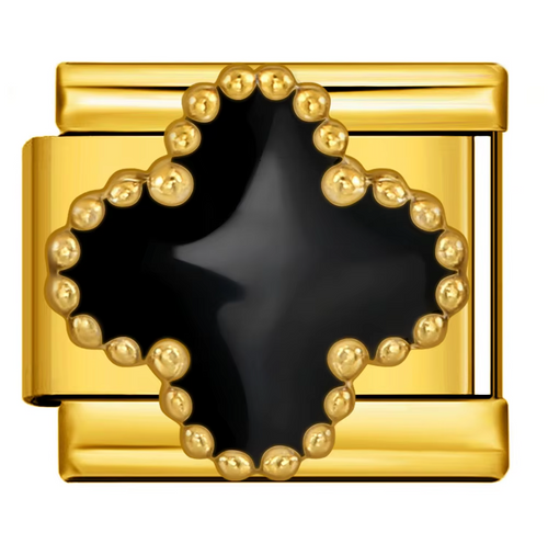 Gold charm with a black clover center on a white background