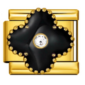 Gold and black decorative item with a central gemstone on a white background