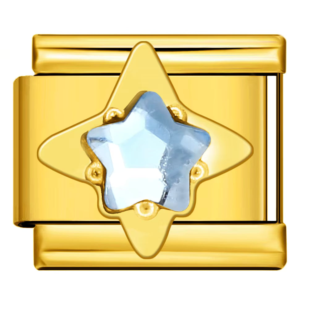 Gold charm with a star-shaped blue gemstone on a white background