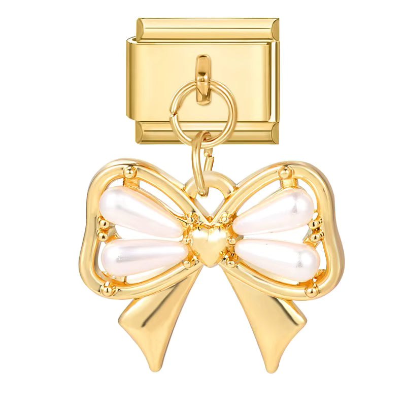 Gold bow-shaped pendant with pearl center on a white background