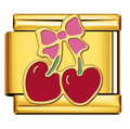 Gold charm with red cherries and a pink bow on a white background