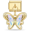 Gold butterfly charm with iridescent wings on a white background