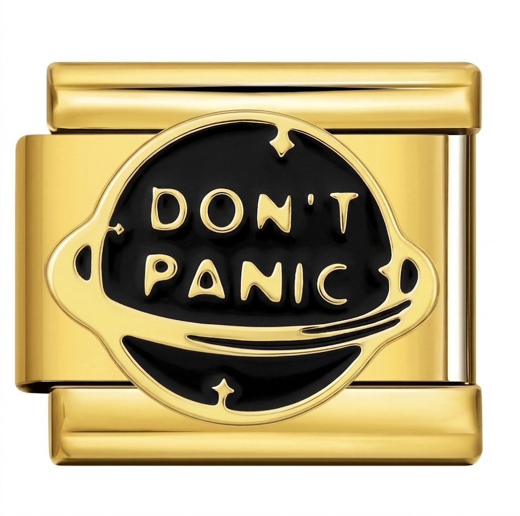 Gold charm with 'DON'T PANIC' text on a black background
