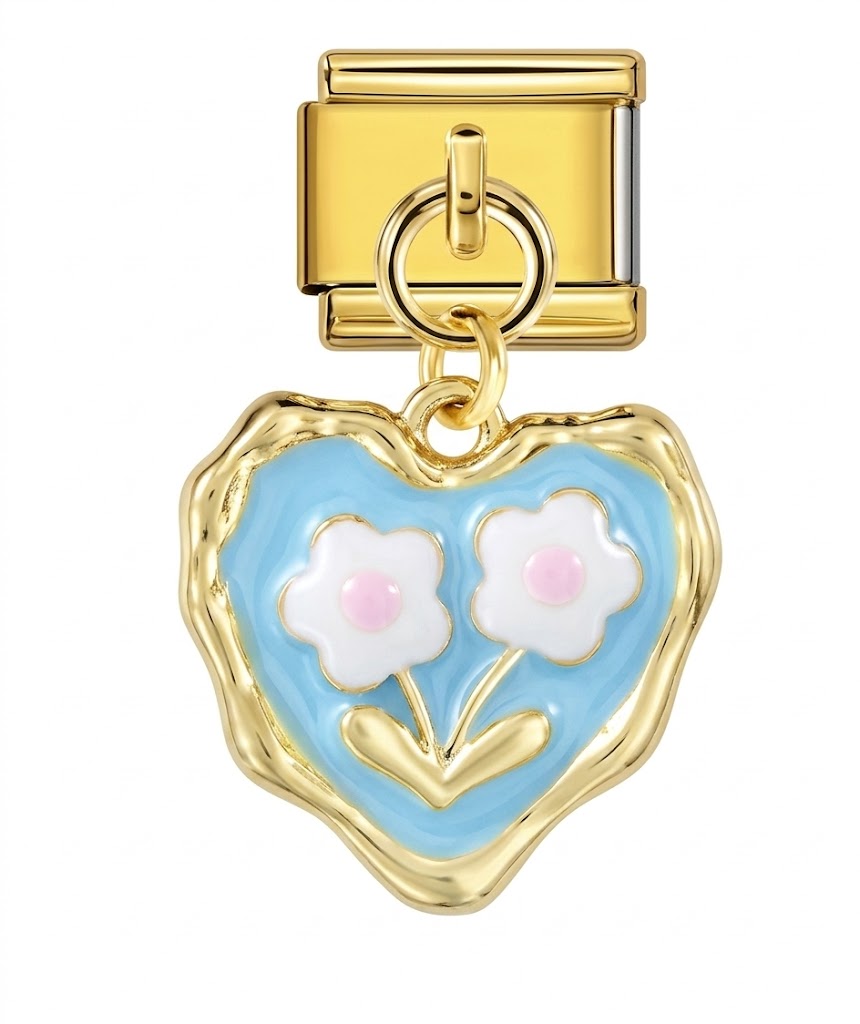 Heart-shaped charm with flowers on a gold clasp against a white background