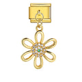 Gold charm with Gold flower-shaped charm with a green gemstone on a white background