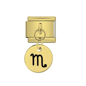 Gold charm with a black Scorpio symbol on a white background