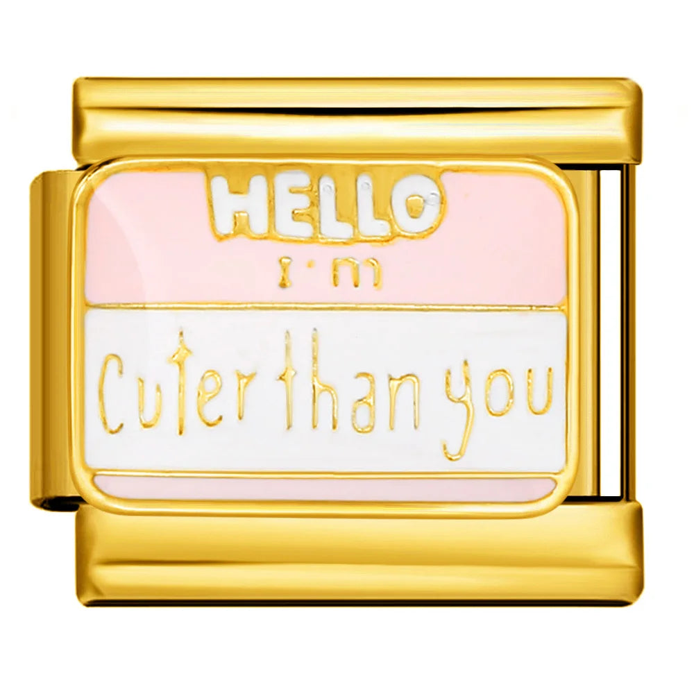 Gold charm with 'Hello I'm Cuter than you' text on a white background