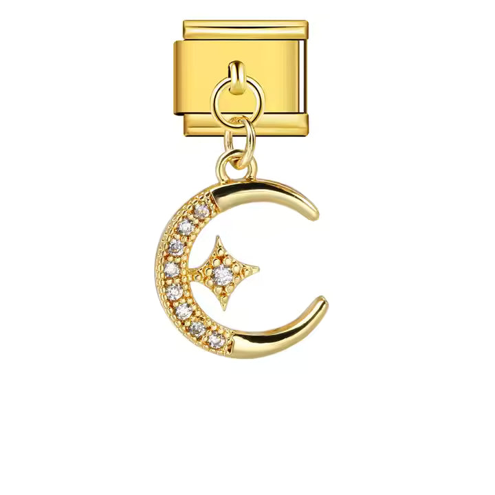 Gold charm with moon and star design on a white background