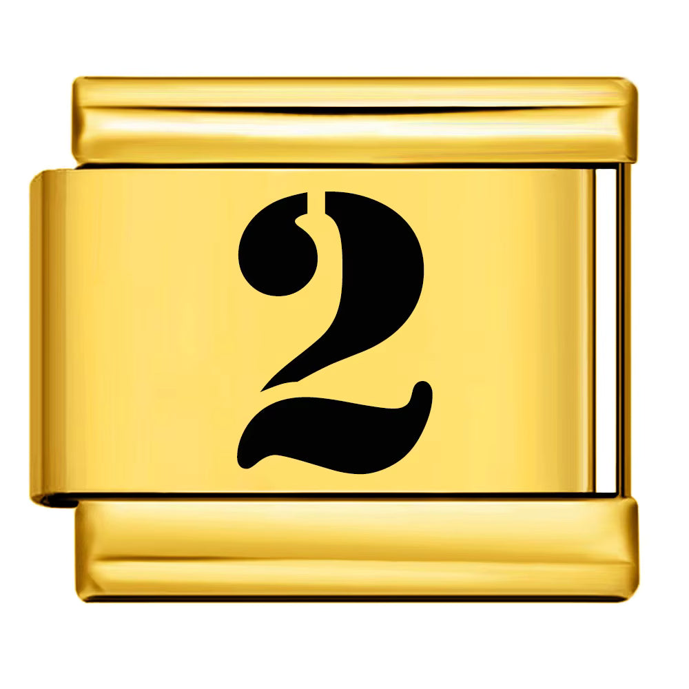 Gold charm with the number '2' on a white background