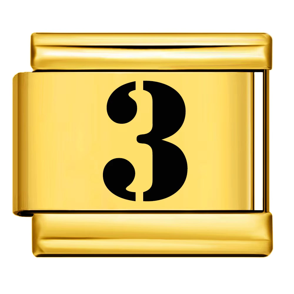 Gold charm with the number '3' on a white background