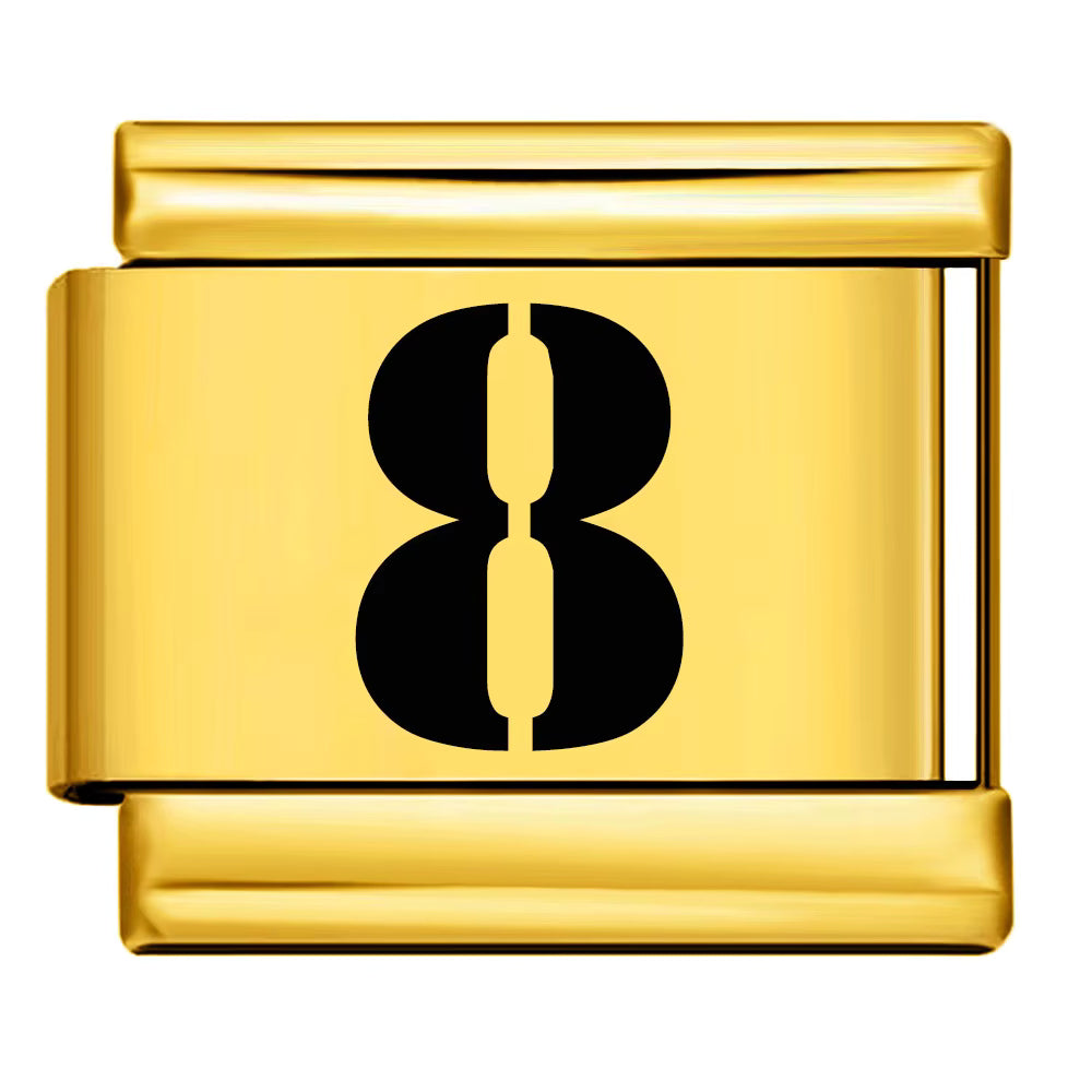 Gold charm with the number 8 on a white background