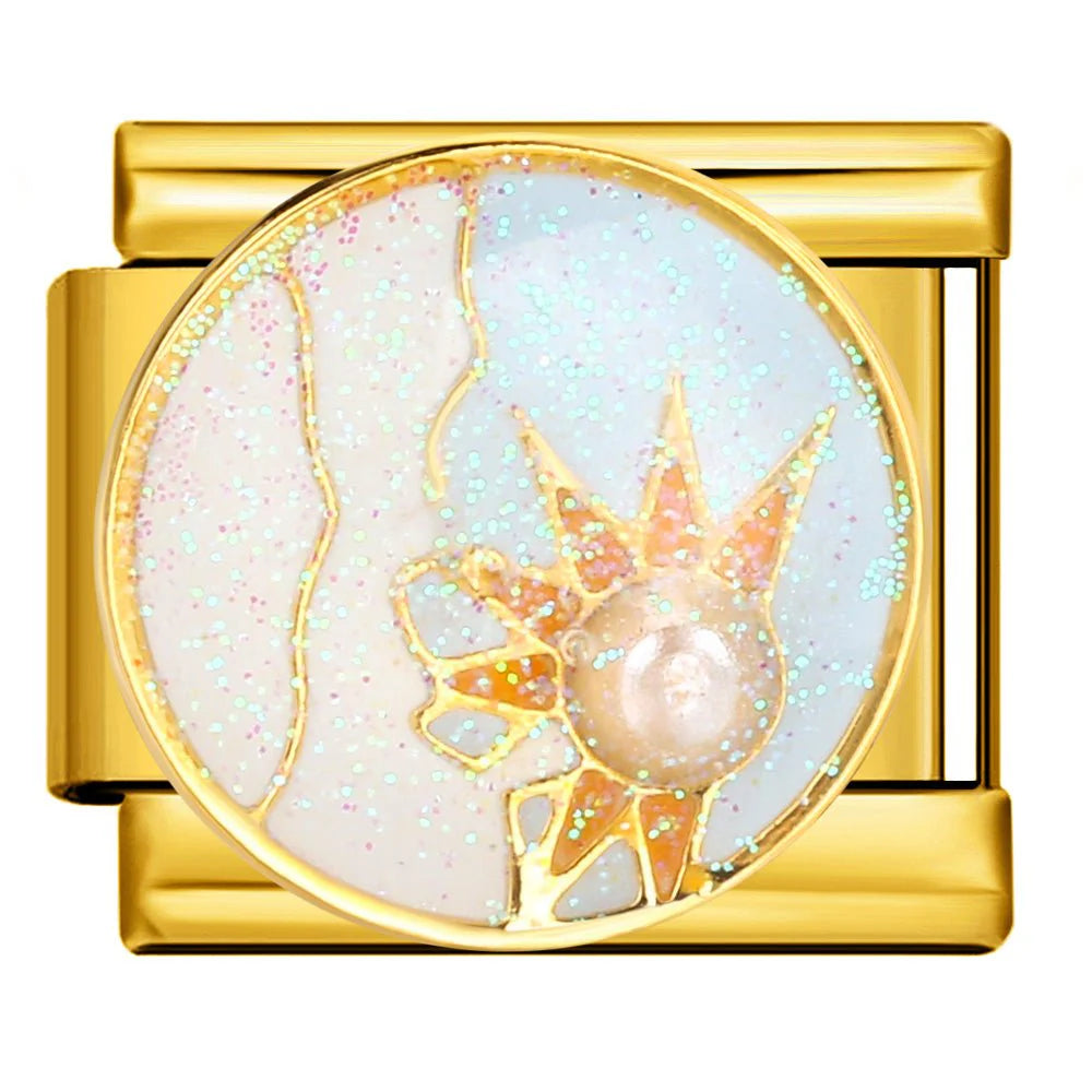 Gold charm with a central design featuring a star and moon on a white background
