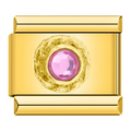 Gold charm with a pink gemstone on a white background