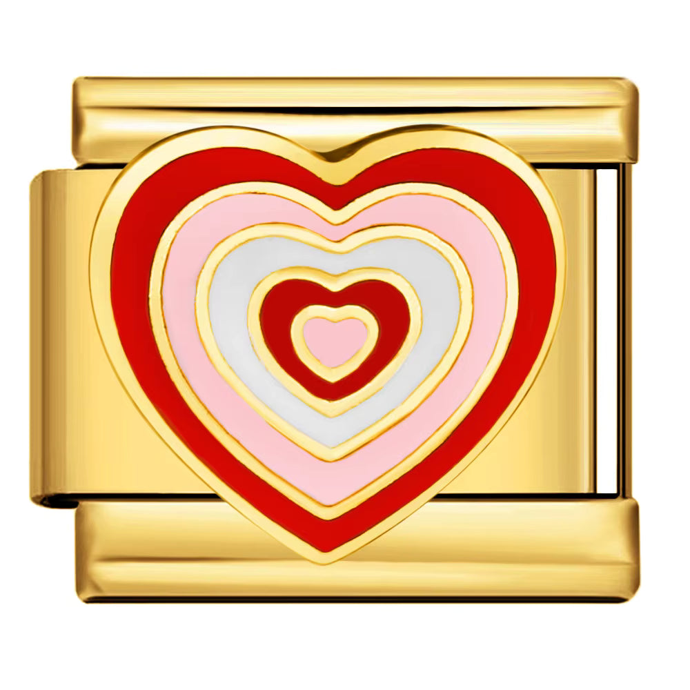 Gold charm with a red and pink heart design on a white background