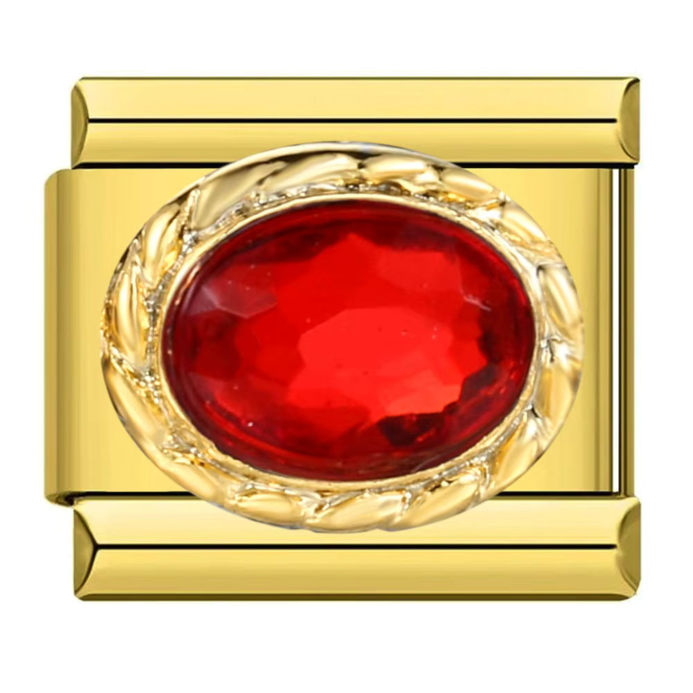 Gold ring with a red gemstone on a white background
