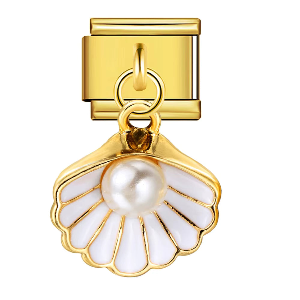 Gold charm with a pearl and white enamel on a white background