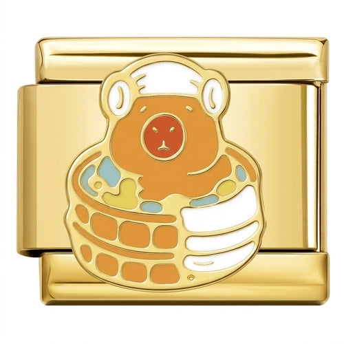 Gold charm with a cartoonish animal design on a white background