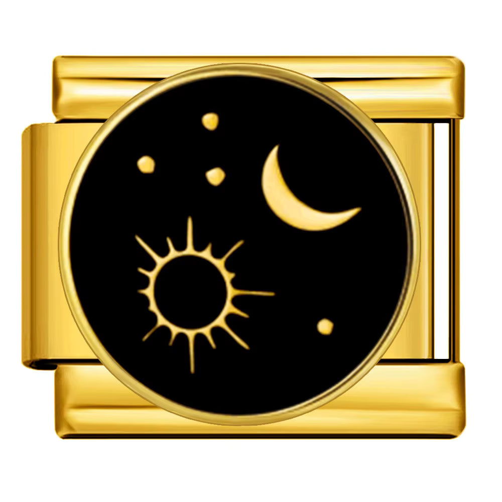 Gold charm with sun, moon, and stars design on a black background