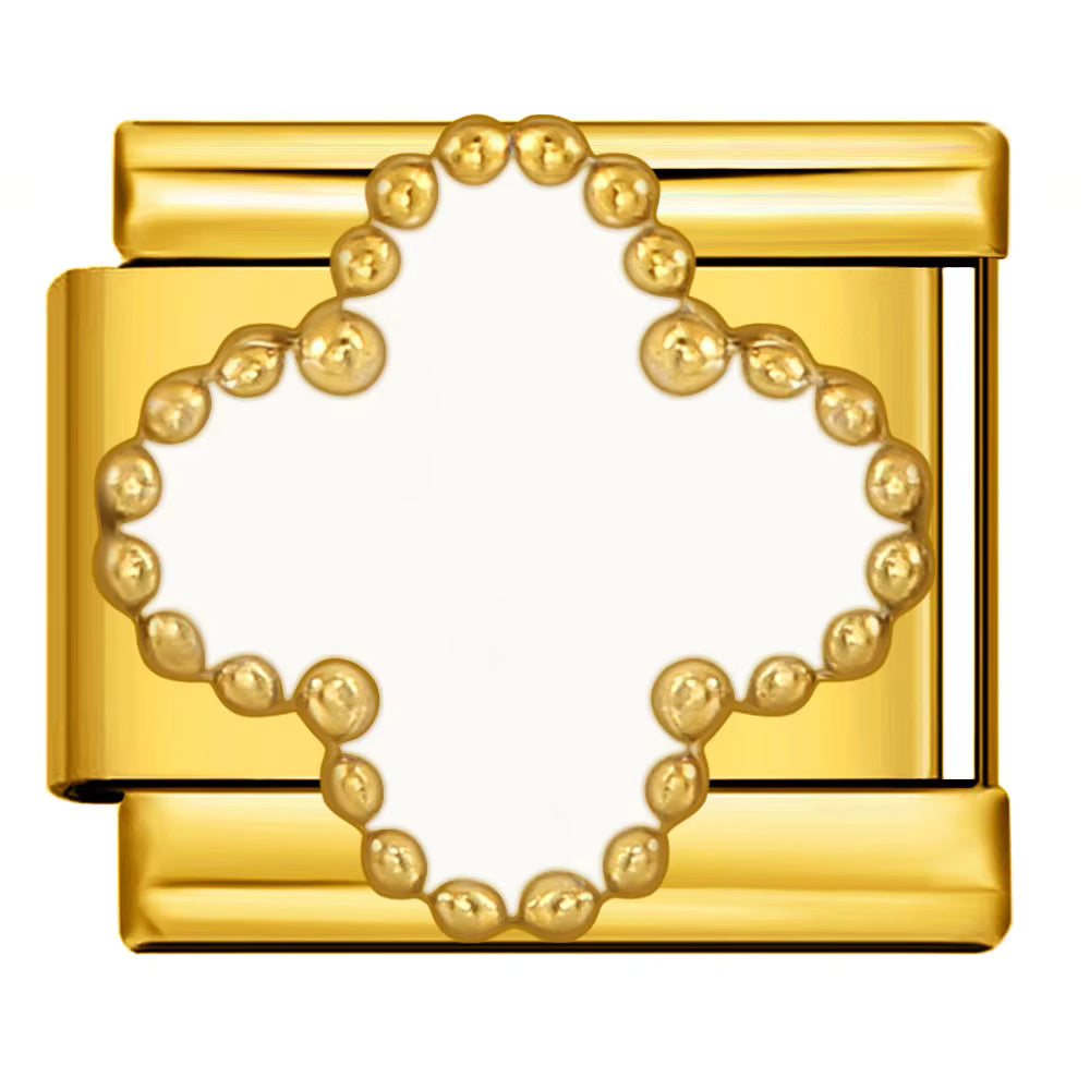 Gold charm with a clover design on a white background