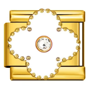 Gold clover charm with a central gemstone on a white background