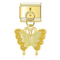 Gold butterfly charm on a white background