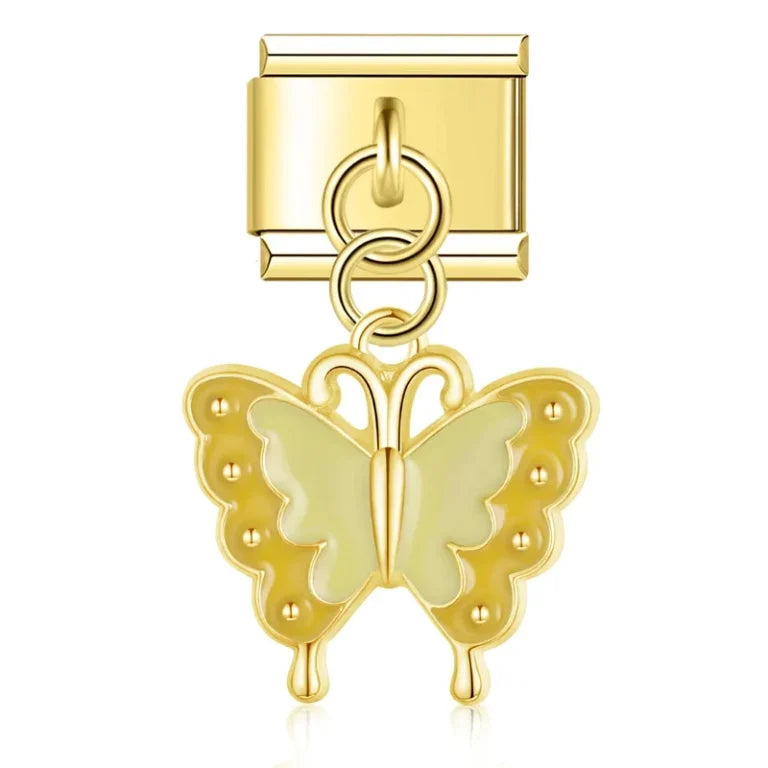 Gold butterfly charm on a white background
