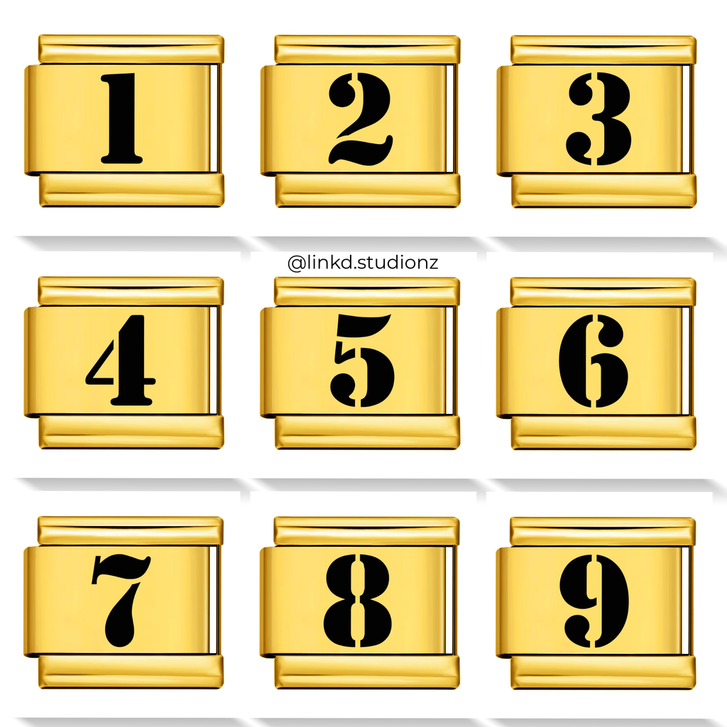 Set of gold number charms with black numbers on a white background