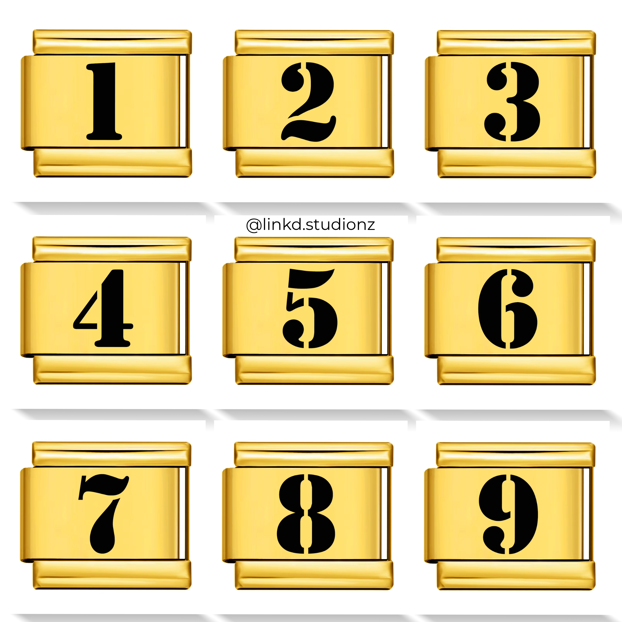 Set of gold number charms with black numbers on a white background