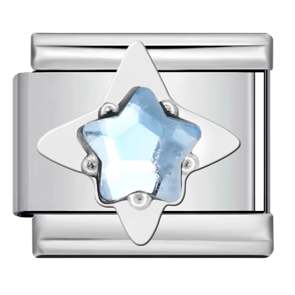 Silver charm with a star-shaped blue gemstone on a white background