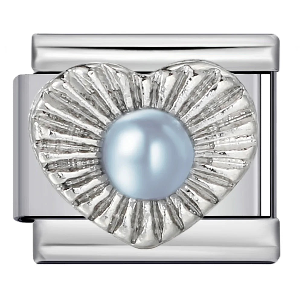 Silver charm with a central blue pearl on a white background