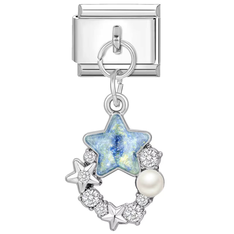 Silver charm with star and pearl design on a white background