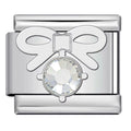 Silver charm with a crystal center on a white background