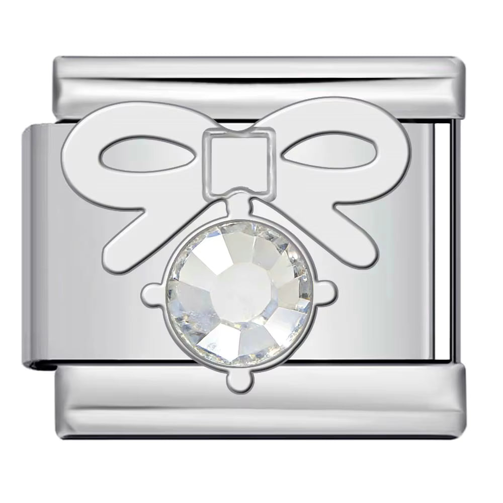 Silver charm with a crystal center on a white background