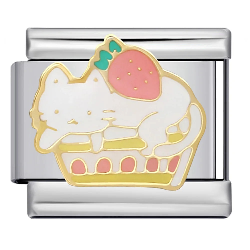 silver charm with a cat in a cupcake design on a white background