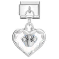 Silver heart-shaped charm with embedded stones on a white background