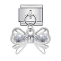 Silver bow-shaped charm with teardrop-shaped crystals on a white background