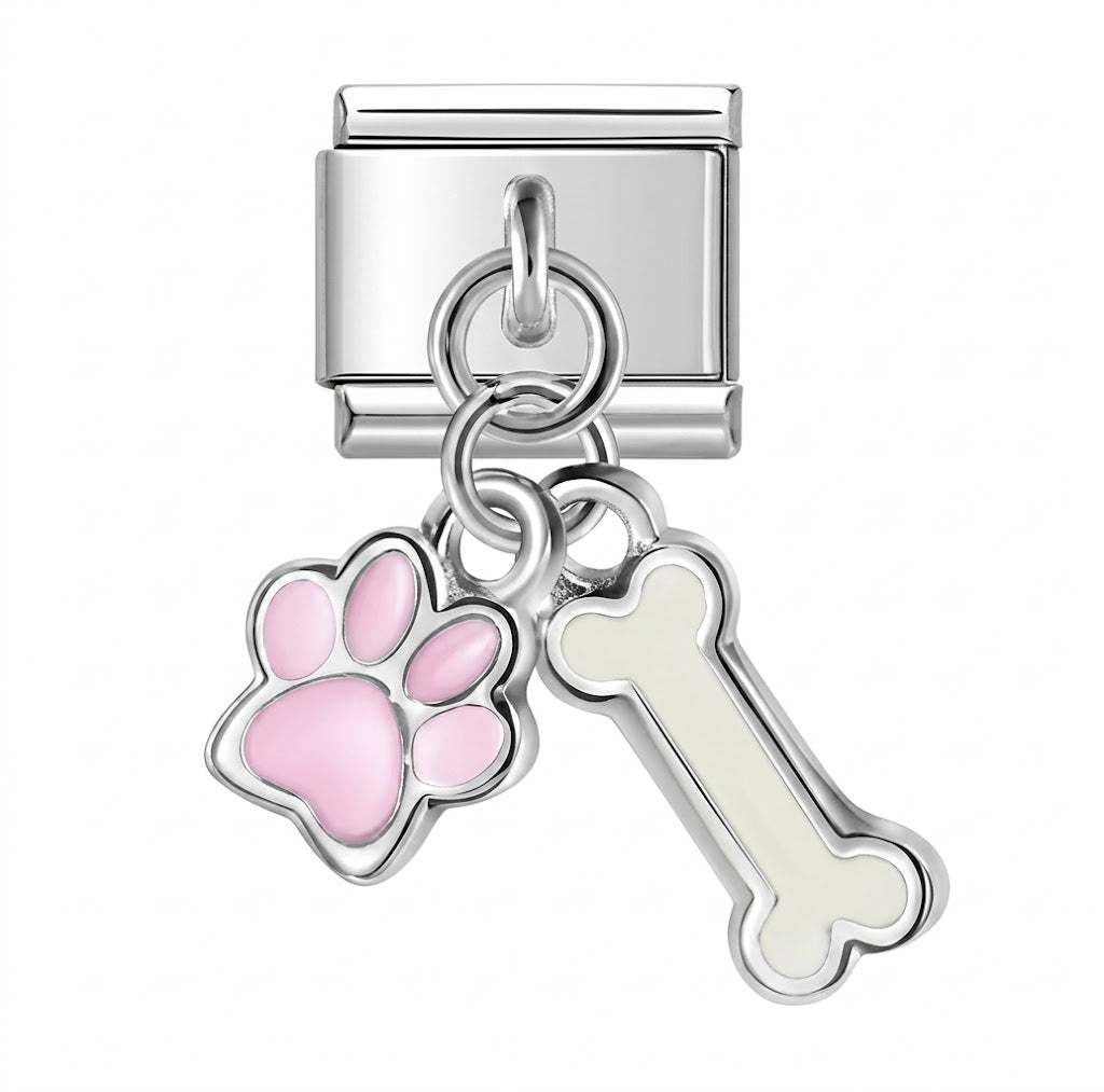 Silver charm with pink paw print and white bone on a white background