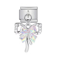 Silver charm with a bow-shaped crystal on a white background