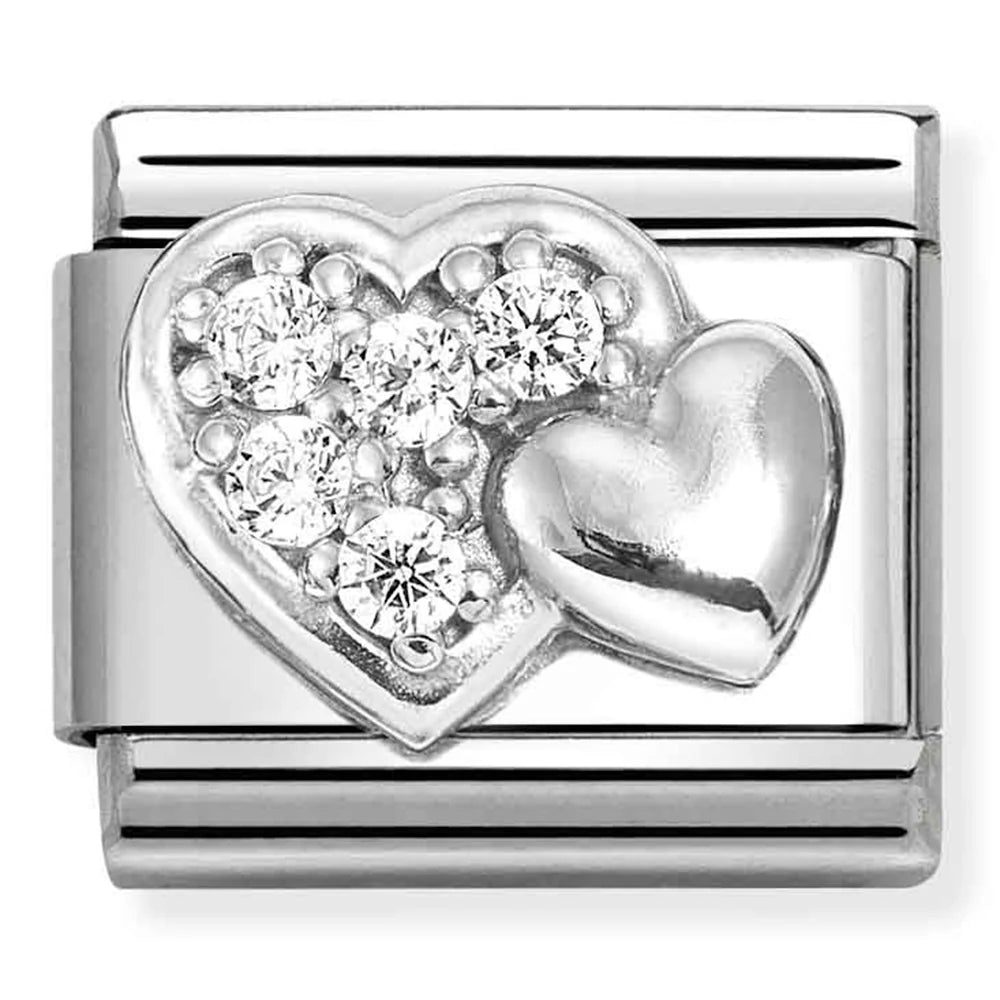 Silver heart-shaped charm with embedded diamonds on a white background