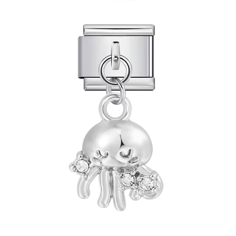 Silver charm shaped like a jellyfish with embedded crystals on a white background