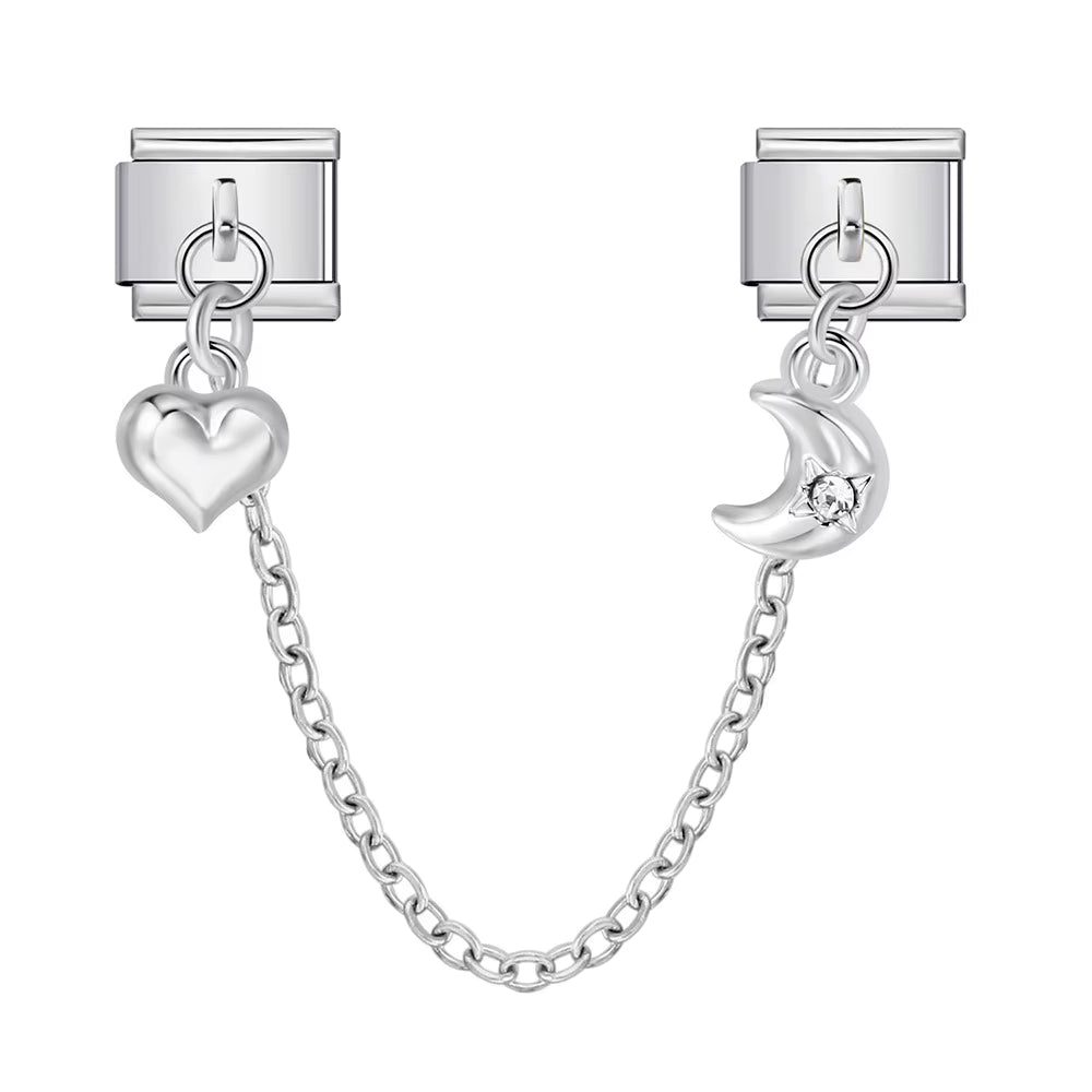 Silver chain with heart and moon charms on a white background