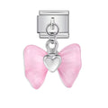 Silver charm with pink butterfly wings and heart in the center on a white background