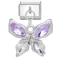 Butterfly charm with purple gemstones on a white background