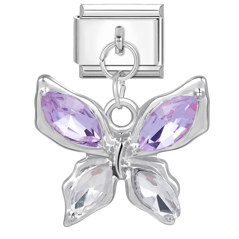 Butterfly charm with purple gemstones on a white background