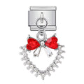 Jewelry charm with red heart-shaped bow and clear stones on a white background