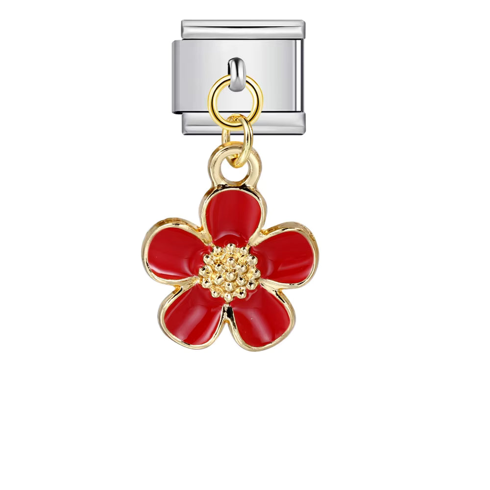 Silver charm with a red flower-shaped pendant on a white background