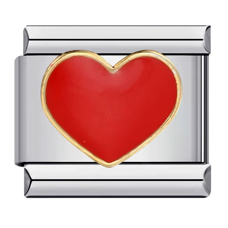 Silver charm with a red heart on a white background