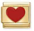 Gold charm with a red heart on a white background